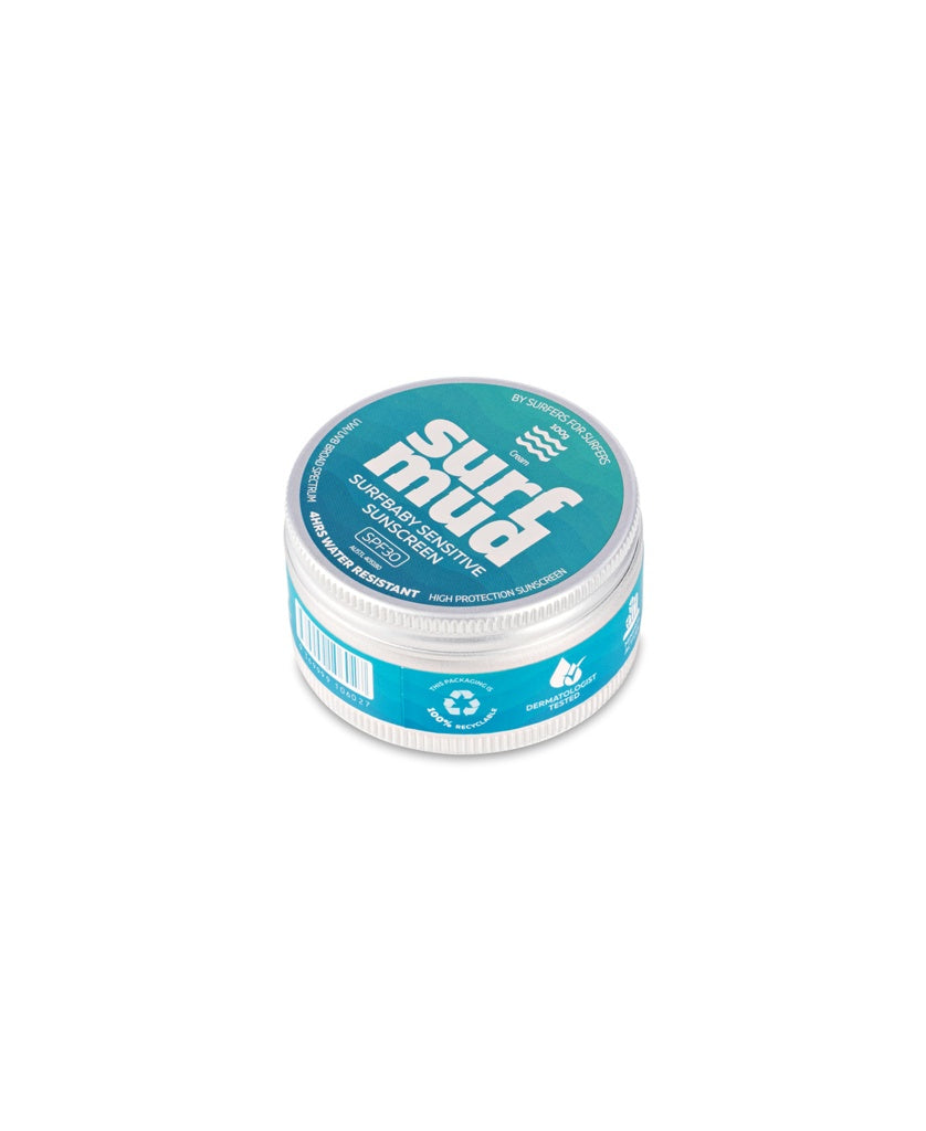 A round tin of Surf Mud’s SurfBaby Sensitive Sunscreen SPF30, featuring a teal label and white lid. This mineral-based sunscreen is formulated with non-nano zinc oxide for gentle, effective sun protection.