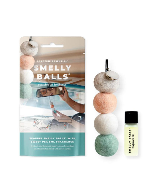 The Smelly Balls Hang Seapink Set | Sweet Pea features four colored wool felt balls on a string with a vial of Sweet Pea fragrance oil, letting you customize your scent experience.