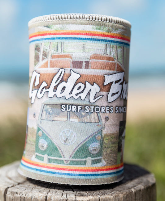The GB Kombi Collage Stubby by Golden Breed is a limited edition holder featuring a vintage Kombi van photo with “Golden Breed Surf Stores Since 1969,” displayed outdoors on wood.